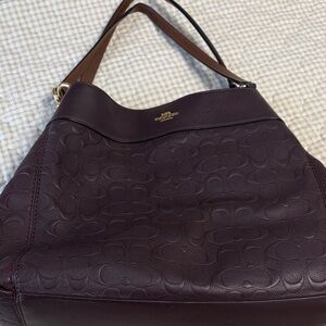 Coach Lexy Shoulder bag embossed with Coach “C” logo in oxblood.
